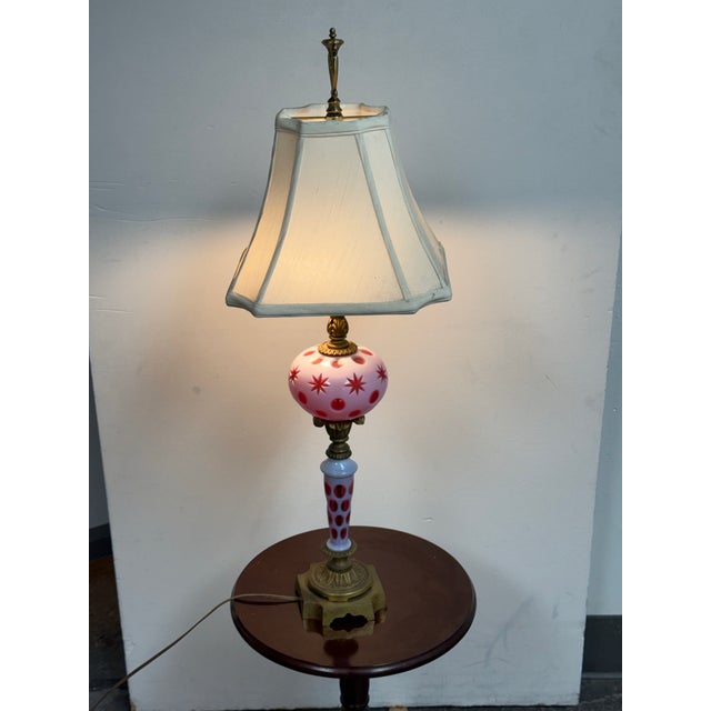 Design Plus Gallery presents a Vintage Fenton Cranberry Opalescent Coin Dot Art Glass Table Lamp. The lamp is composed of...