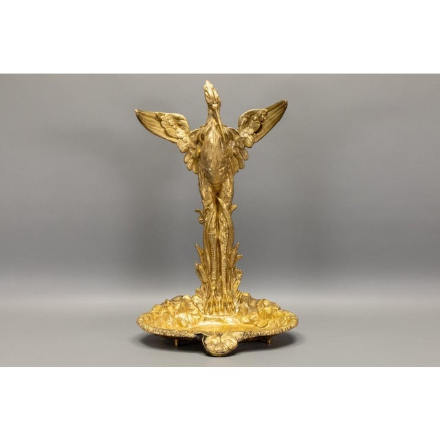 Sculptural French umbrella and walking stick stand executed in the Art Nouveau style, featuring a finely modeled heron...