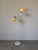 A sleek and highly functional 1970s Mid-Century Modern floor lamp by Lightolier, featuring two adjustable metal shades...
