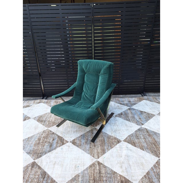 Mid-Century Modern with a cantilevered or Z-shaped frame constructed from flat steel bar. •Features a tufted cushion,...