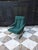 Mid-Century Modern with a cantilevered or Z-shaped frame constructed from flat steel bar. •Features a tufted cushion,...