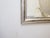 This silverleaf mirror has a rubbed old patina and measures 42"H x 26"W.