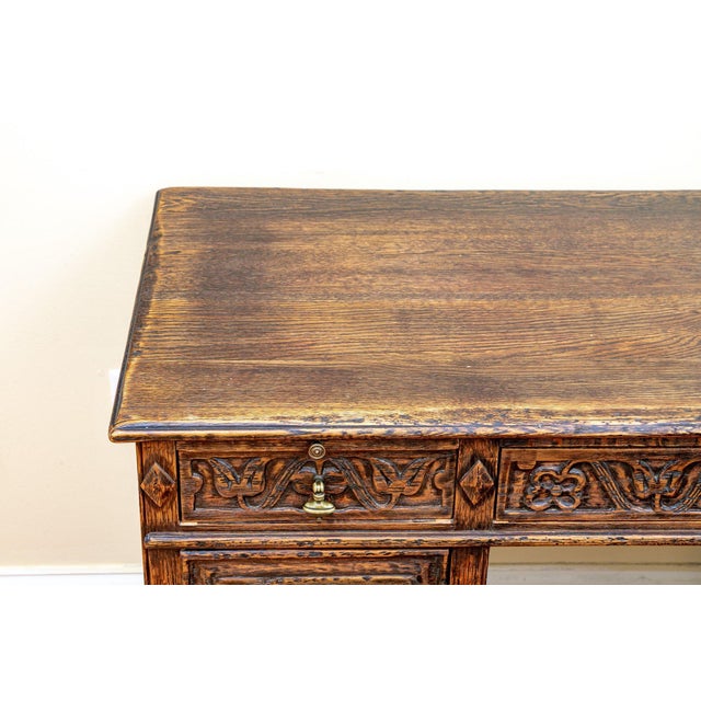 A Spanish Colonial Revival desk and chair set bearing the Feudal Oak label for Jamestown Lounge Co. of New York — one of...