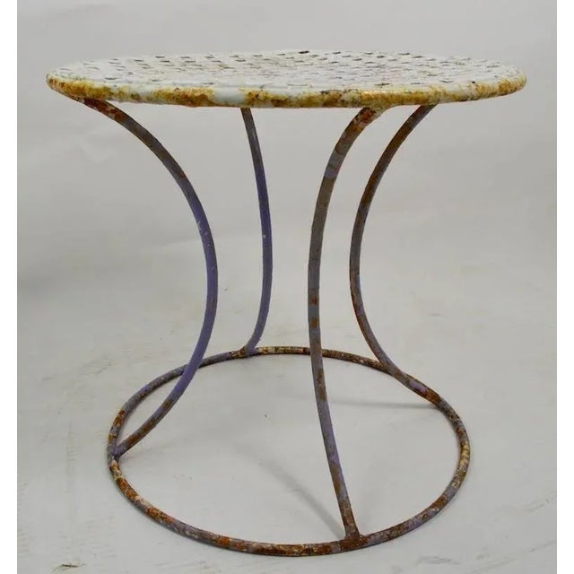 Stylish wrought iron stand having weave pattern top, with waisted form base. This example is currently in old paint...