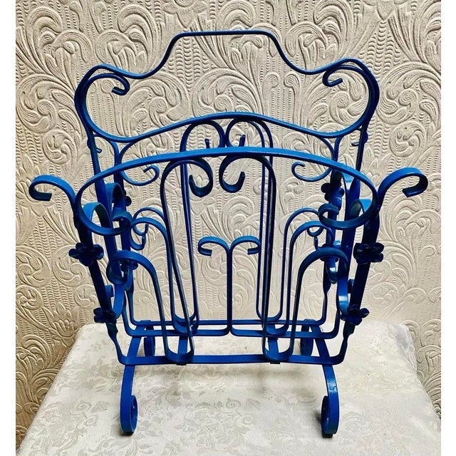 Vintage Mid Century Blue Enameled Scrolled Iron and Flowers Magazine Rack Such a treasure in a beautiful color! One of a...