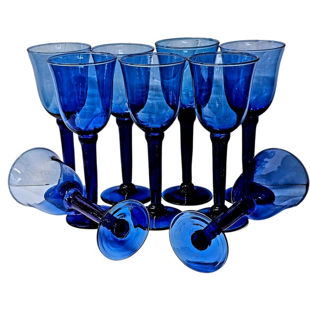 A vintage set of nine cobalt blue Mexican art glass stem glasses, handblown and individually crafted in Mexico. Each glass...
