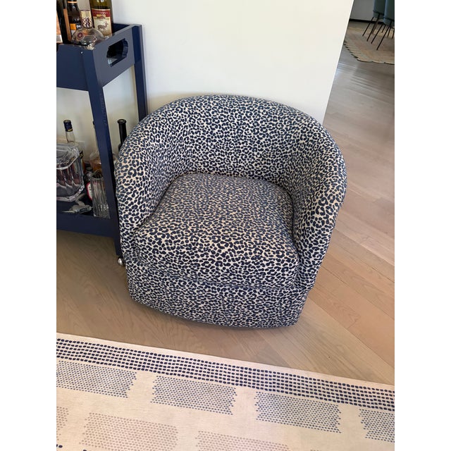 Beautiful swivel custom chair in a cool navy cheetah print in excellent condition. Measurements are 32wx31dx27h. Inside...