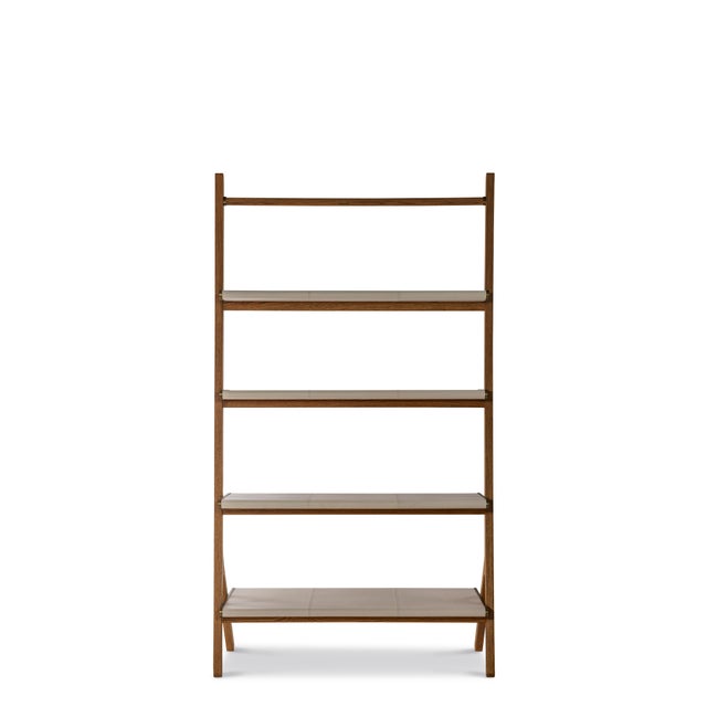 Sleek, sculptural, and functional, this ladder-style étagère reimagines modern display with refined craftsmanship. The...