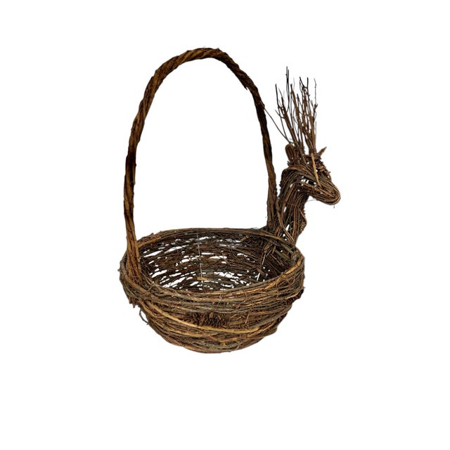 Vintage natural vine and pinecones are woven together to for this stag deer basket. Overall Measures 18” w x 12” d x 18”...