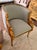 Gorgeous pair of gilt accent chairs with arms of carved swans. Recently reupholstered in Kravet pale blue performance...