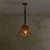 A 1960s French lantern pendant in the manner of Louis Sognot. The bell-shaped shade is formed from a lattice of bent...