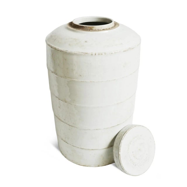 Beautiful vintage white ceramic round storage jar with lid. Collected from North China, these aged ceramics make wonderful...