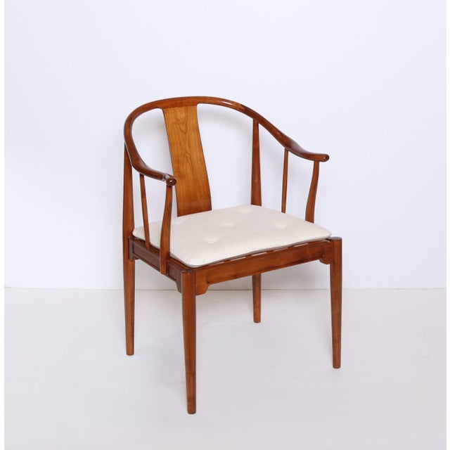 A Pair of China Chairs by Hans J. Wegner for Fritz Hansen. Designed in 1944 and manufactured by Fritz Hansen. Stained...