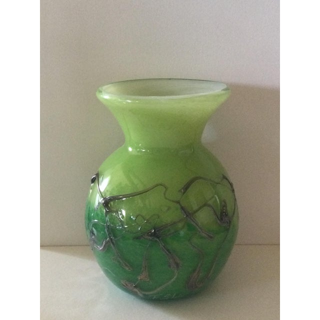 Vase made entirely by hand, using the three-layer blown glass technique. First layer: opaline white; second: apple green...