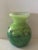 Vase made entirely by hand, using the three-layer blown glass technique. First layer: opaline white; second: apple green...