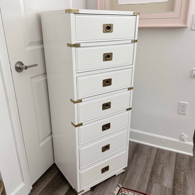 This stunning vintage Thomasville Campaign-style lingerie chest captures the timeless elegance of Hollywood Regency...