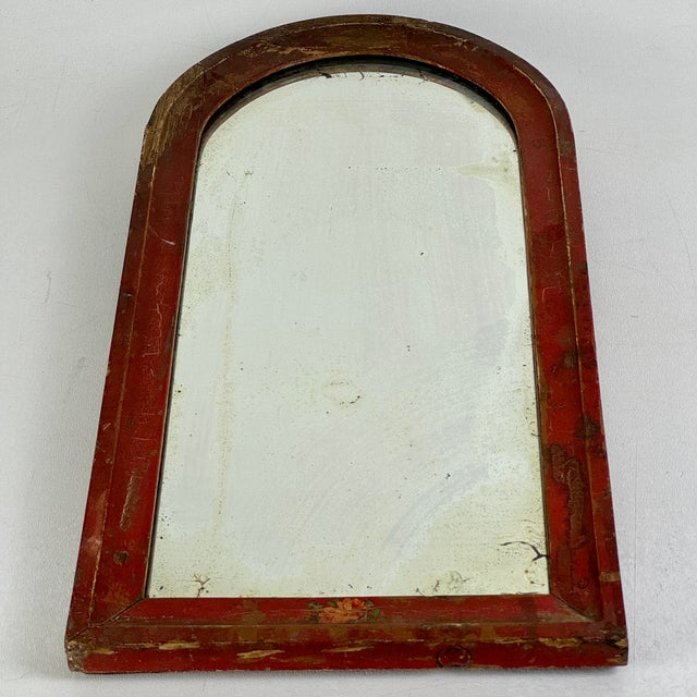 A rare to market small arched top wood framed antique mirror. Lovely distressed glass and naturally aged wood frame. The...