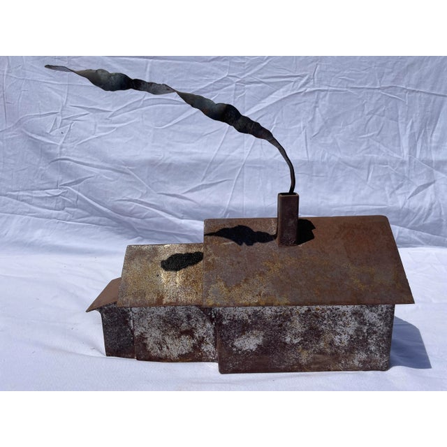 Rusty little house sculpture with chimney and trail of smoke .... handmade. The measurement below doesn't reflect the...