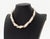 Pomellato 18K Yellow Gold and Baroque Pearl Multi-Strand Necklace, decorated with one black baroque seed pearl strand and...