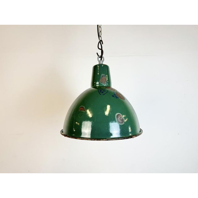 Industrial green enamel pendant light made by A23 factory in Wilkasy in Poland during the 1960s. White enamel inside the...