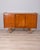 Teak veneered wood sideboard with three sliding doors and black metal handles with gold-plated brass details, Italian...