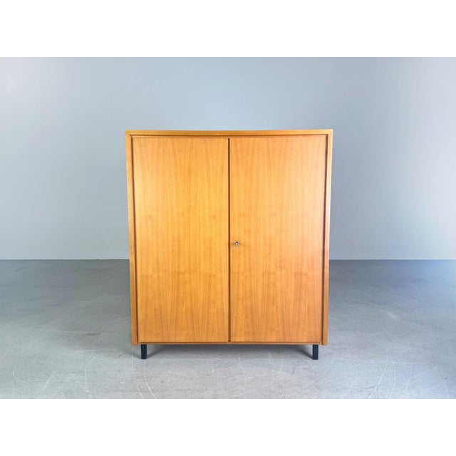 Beautiful small WK Möbel cabinet from the 1960s. The cabinet has two doors and is made of high-quality walnut. The four...