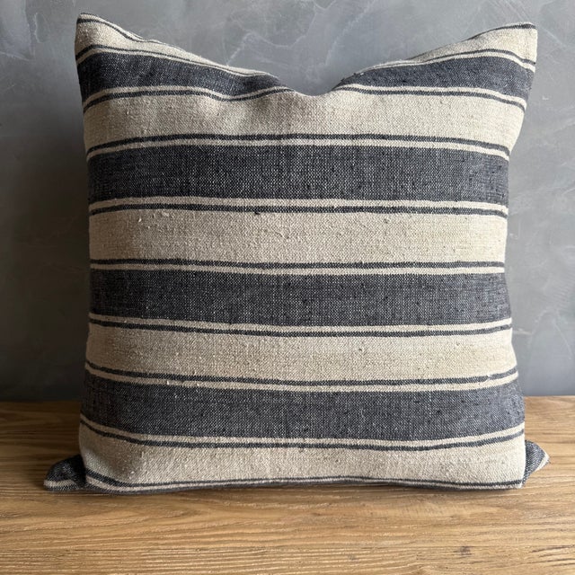Creamy white hemp rug pillow with stripes. Soft hand, linen blend backing with zipper closure. Spot cleaning is...