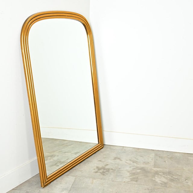 Dimensions: 51 ½” H x 34 ¾” W x 1” D A classic French Louis Philippe style gilt-painted, reeded mirror from the 1800s in...