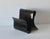 A Kartell style black acrylic magazine rack. Fabulous design evokes a wide ribbon. In good vintage condition with some...