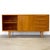Dimensions: 59 1/8” L x 19” D x 29 7/8” H Origin: German Democratic Republic (East Germany) Designer: Franz Ehrlich...