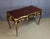 A Louis XV style marquetry desk resting on four cabriole legs with canted corners, 19th century. This desk features three...