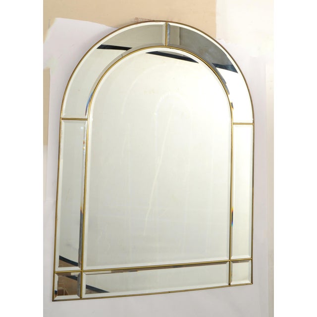 This Stunning 1970s Venetian Arch Wall mirror is a refined decorative piece featuring a beveled glass central panel with...