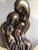 Twentieth century contemporary sculpture. The sinuous shape with a root-like base. The merging forms may suggest unity and...