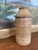 This vintage studio pottery jar features a hand-thrown cylindrical form with a domed, fitted lid. The surface is decorated...