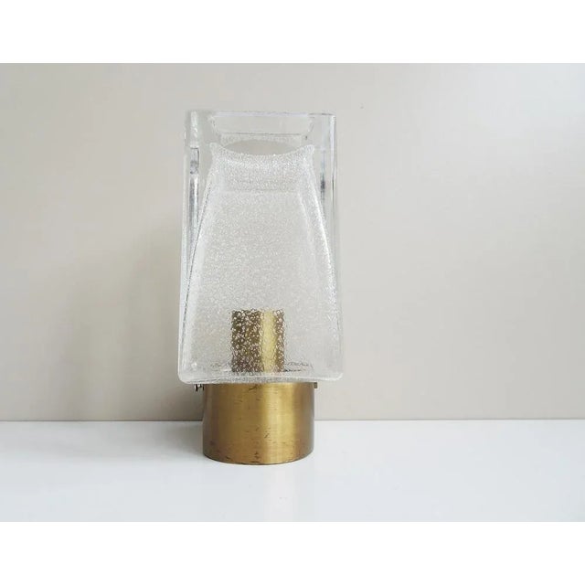 This elegant wall lamp from the 1970s is a wall lamp from glashütte limburg with model number a 249. A noble and high...