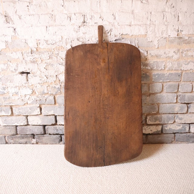 Add rustic charm and authentic French heritage to your space with this 19th century French oak cutting board, a...