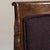 A red wood, Empire-style armchair, dating to the early 20th century and made in France. The wood frame is finished in...