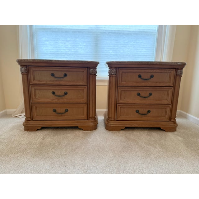 Exceptional pair of Stanley Furniture Coronation Collection Bachelor's Chest featuring original marble tops, carved column...