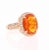 This ring has a 3.30 carat Oval Cut Fire Opal in the center of the ring and is surrounded by 66 Round Cut Diamonds that...