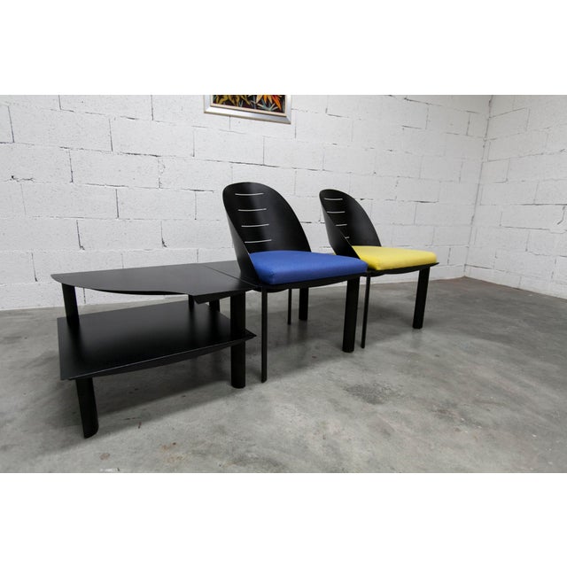 Set of two armchairs and matching coffee table, designed by Patrice Bonneau and manufactured by Genexco in 1980. All three...