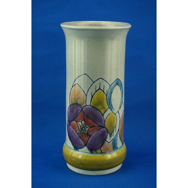 A magnificent large cylindrical majolica ceramic vase, entirely hand-modeled on a lathe, glazed, and decorated by hand...