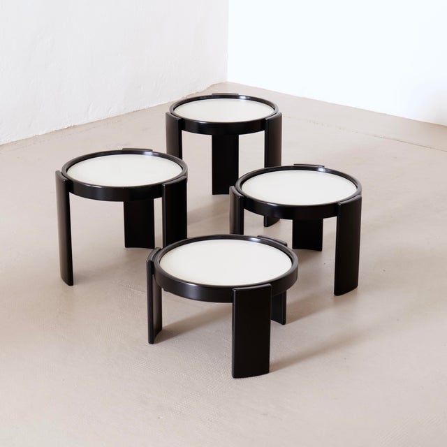 Minimalist vintage tables with reversible tops in black or white. Designed by Gianfranco Frattini and manufactured by...