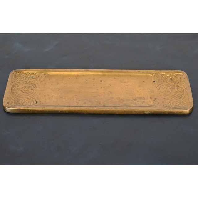 A gorgeous antique Arts & Crafts gilt bronze pen tray featuring Zodiac designs By Tiffany Studios (signed to the...