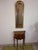 Vertical beveled mirror in a frame with glazing beads. Gilt wood frame, Louis XVI style motifs of pearls and fleur-de-lis.