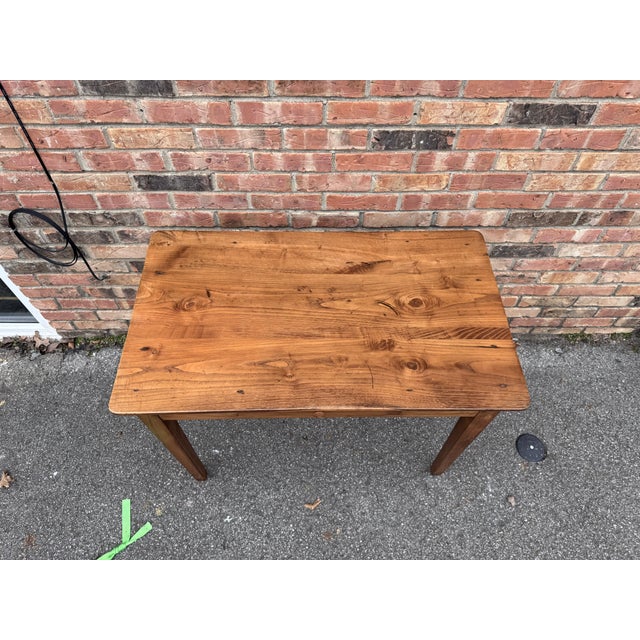 This is a beautiful table in Provencal style, circa France 1920's. It a heavy quality Elmwood table with functional front...