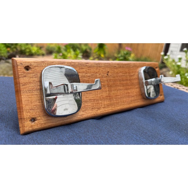 Exuding a Mid Century Modern vibe this vintage solid teakwood and polished chrome finish coat rack would look great in a...