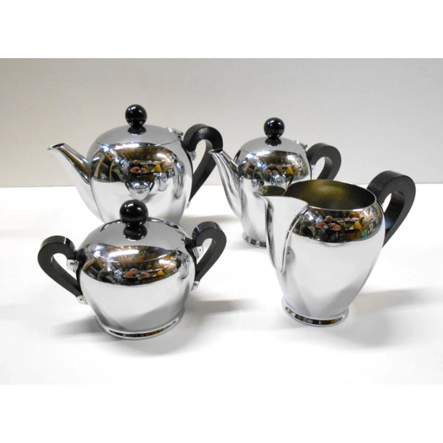 This set of five pieces has a round tray which is included in the set. Total: 5 pieces. This piece has an attribution...