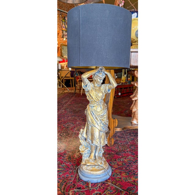 "Girl Dressing Her Hair" Figure Table Lamp by August Moreau. This lamp has been tastefully gilded with gilding wax and...