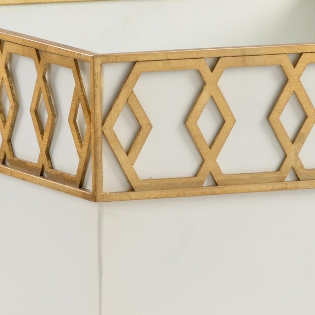 A classic planter featuring metallic satin gold interlocking honeycomb detail to elevate the look of any powder room or...