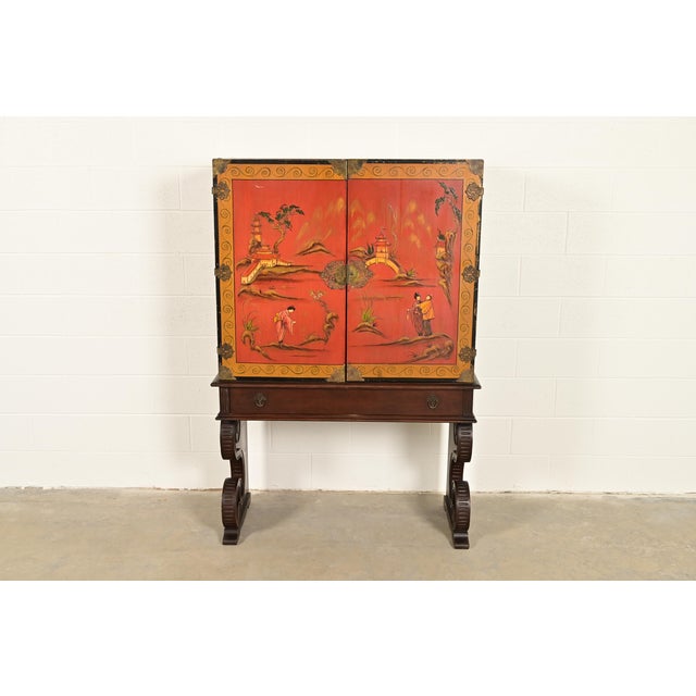 A gorgeous Hollywood Regency Chinoiserie style bookcase, dining cabinet, or bar cabinet In the manner of Berkey & Gay USA,...